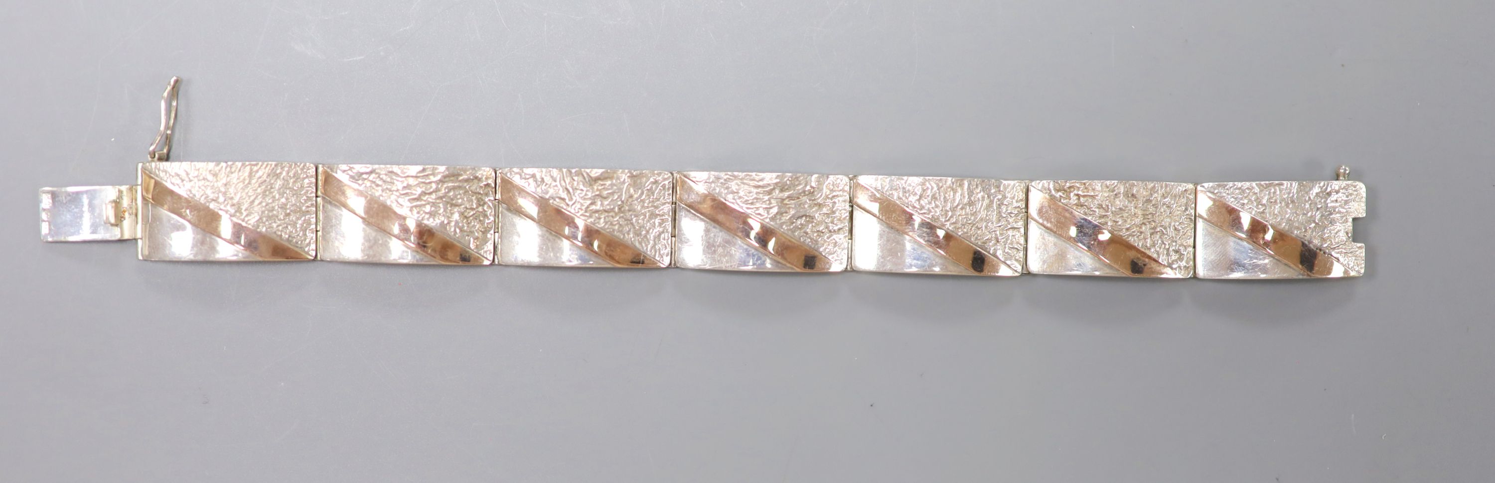 A 20th century white and yellow metal (stamped 925 & 375) demi-lune link bracelet, 21cm, gross 50.9 grams.